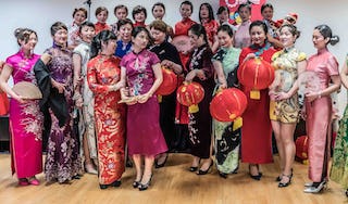 Women dressed in the traditional Qipao dress